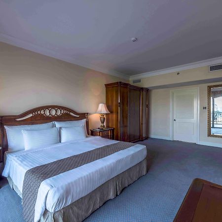 فندق بالاس أوف ذي جولدن هورسيز سيري كيمبانغان المظهر الخارجي الصورة A bedroom at the hotel